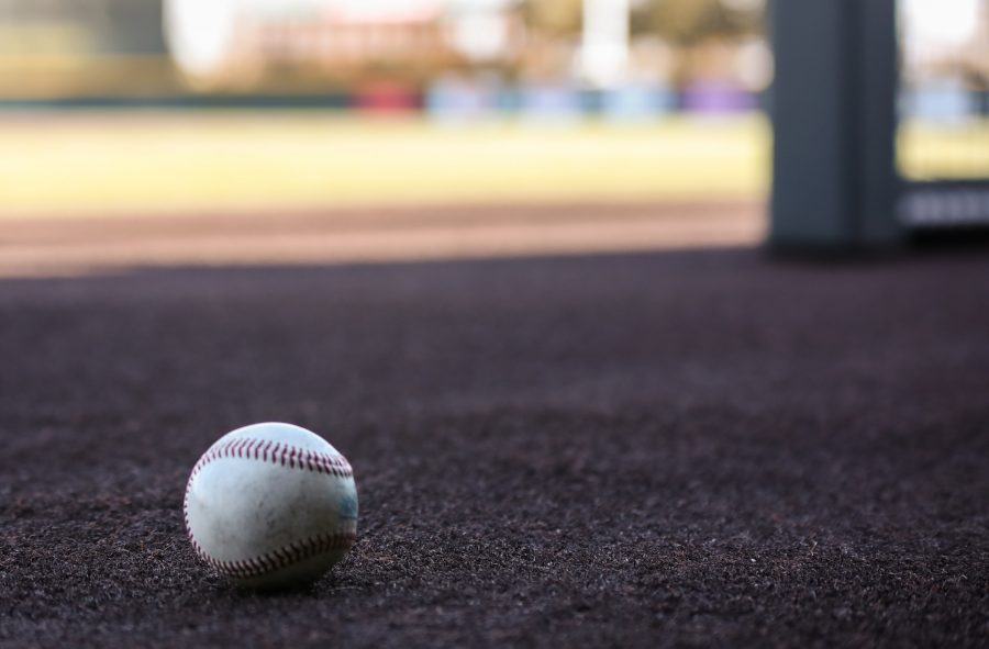 A lone baseball sets on the edge of the dugout at Eck Stadium.