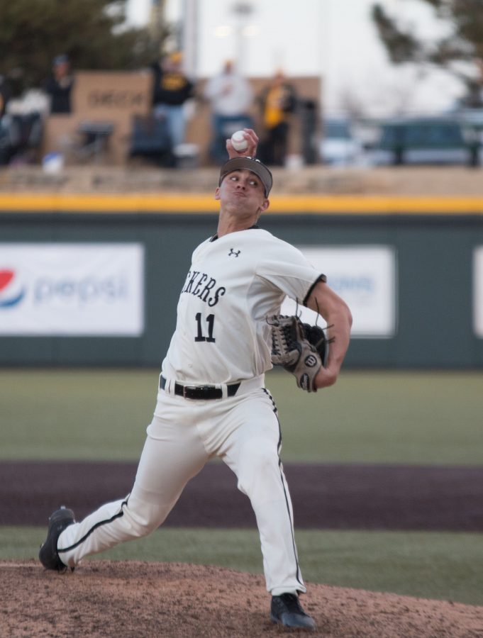 Wichita States Ben Hecht winds up for a pitch during the game against Utah Valley. Hecht pitched during one inning of the game. (Feb. 17, 2017)