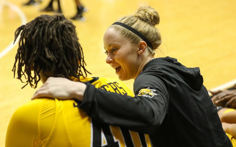 Wichita State senior Hannah Mortimer (2) puts her hand around Angiee Tompkins (40) in the second half of Sunday’s game. (Feb. 26, 2017)