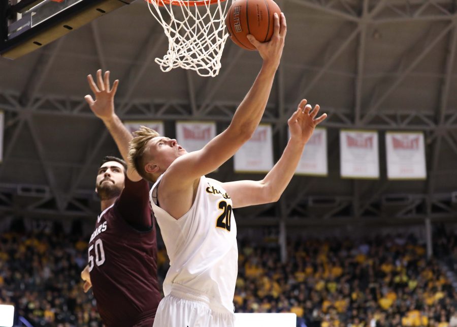 Wichita State Junior Rauno Nurger (20) twists around for a lay-up Thursday night against Missouri State. Nurger had 10 points for the Shockers in the 80-62 victory over the Bears. (Feb. 9, 2017)