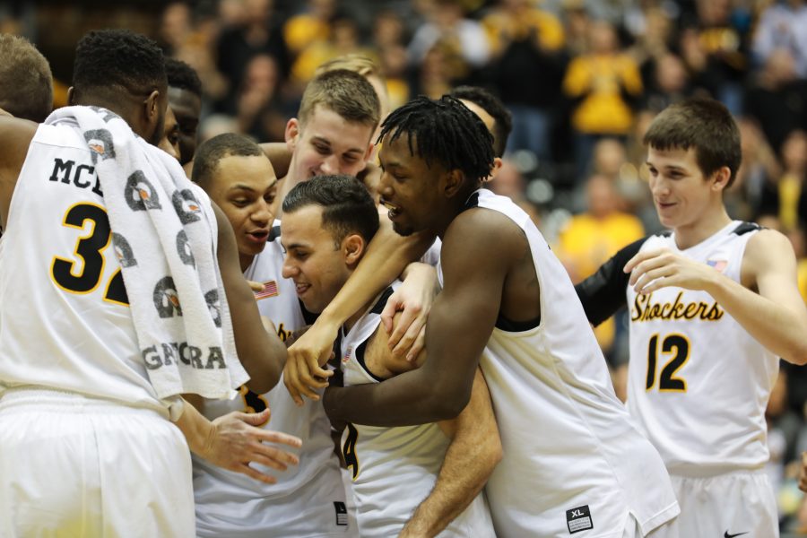 Wichita State guard John Robert Simon (14), center, is embraced by the team after the win against Evansville. Simon was honored as part of the senior night celebration. (Feb, 21, 2017)