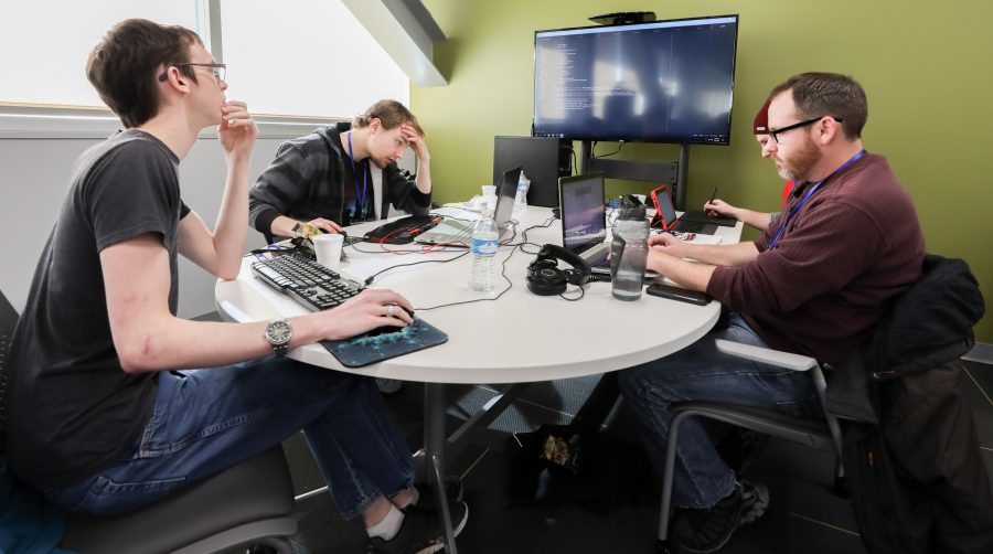 From left: Jesse Pritchard, Brandon Jones, Steven Reust and Nathan Branded work on coding a game from start to finish at the Wichita eSports Convention. The group was competing in the ICT Game Jam for a cash prize. (Feb. 5, 2017)