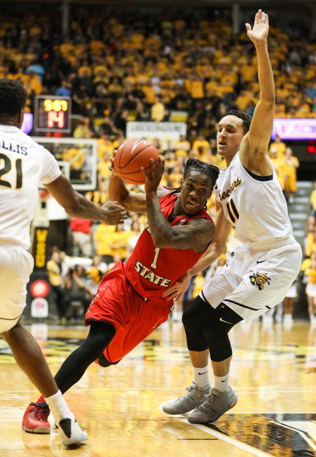 Illinois State guard Paris Lee (1) drives into Wichita State guard Landry Shamet (11) during the first half of the game inside Koch Arena. WSU went on to beat Illinois State 86 – 45. (Feb. 4, 2017)
