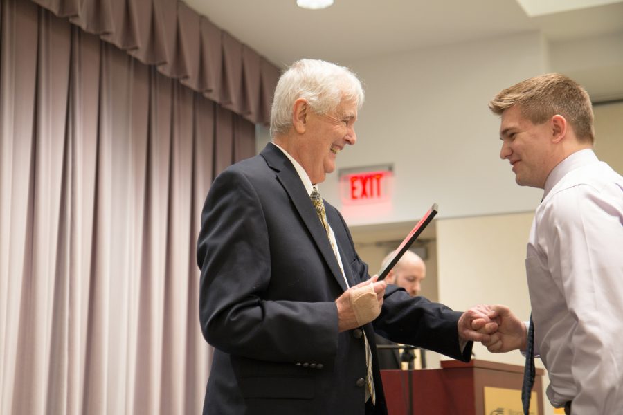 President+Bardo+presents+a+Wallace+Scholar+recipient+with+his+award.