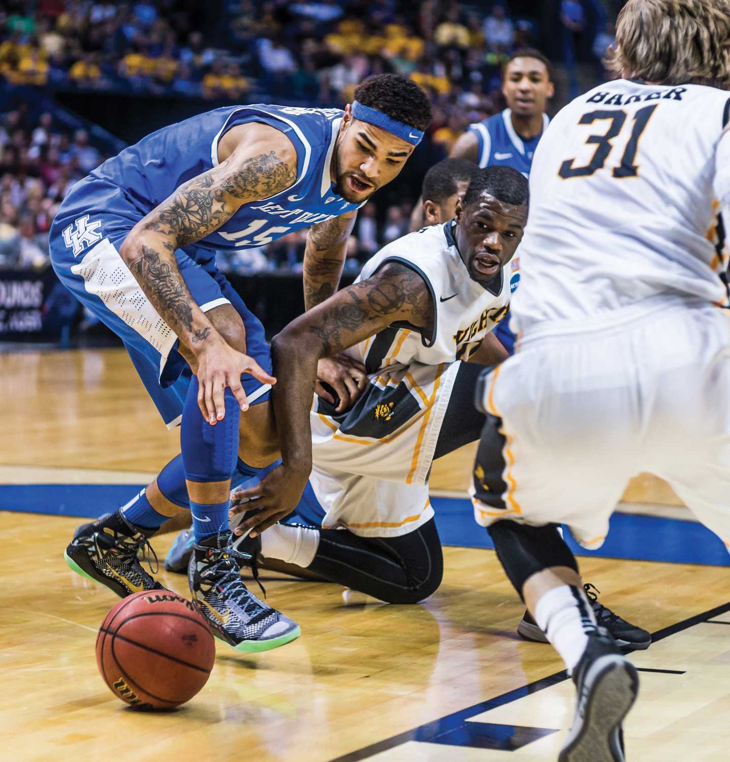 Senior Chadrack Lufile goes after the loose ball during the Wichita State vs Kentucky game Sunday evening inside the Scottrade Center Arena in St. Louis for the Round of 32 of the NCAA Tournament. The Shockers failed to beat the Wildcats and lost 78-76.