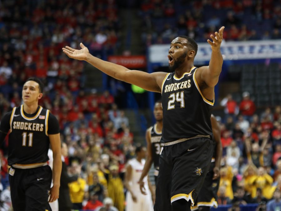 Wichita State’s Shaquille Morris (24) pumps up the bench early in the game.