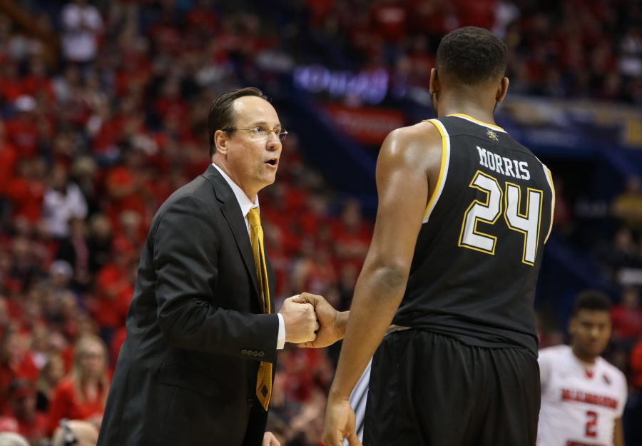 Wichita State head coach Gregg Marshall praises Shaquille Morris (24) towards the end of the championship game.