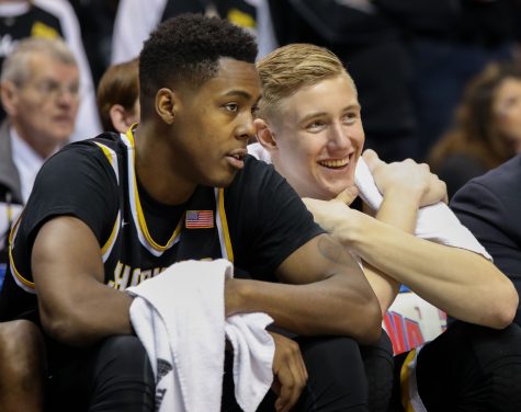Wichita State’s Darral Willis (21) and Rauno Nurger (20) sit on the bench. Nurger grins, realizing Wichita State is going to win.