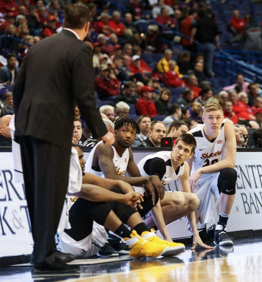 Wichita State players get last minute advice before subbing into the game.
