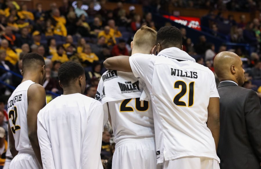 Wichita State’s Rauno Nurger (20) and Darral Willis  (21) join the team huddle during a timeout.