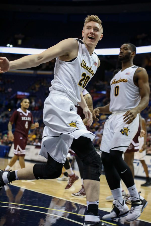 Wichita State center Rauno Nurger (20) grins after driving to the basket.