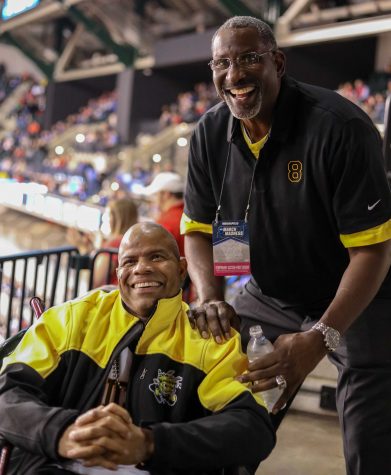Cliff Levingston poses for a photo with long time fan Darren Thomas. Levingston played basketball for Wichita State from 1979-1982  before being drafted by the Detroit Pistons in 1982.