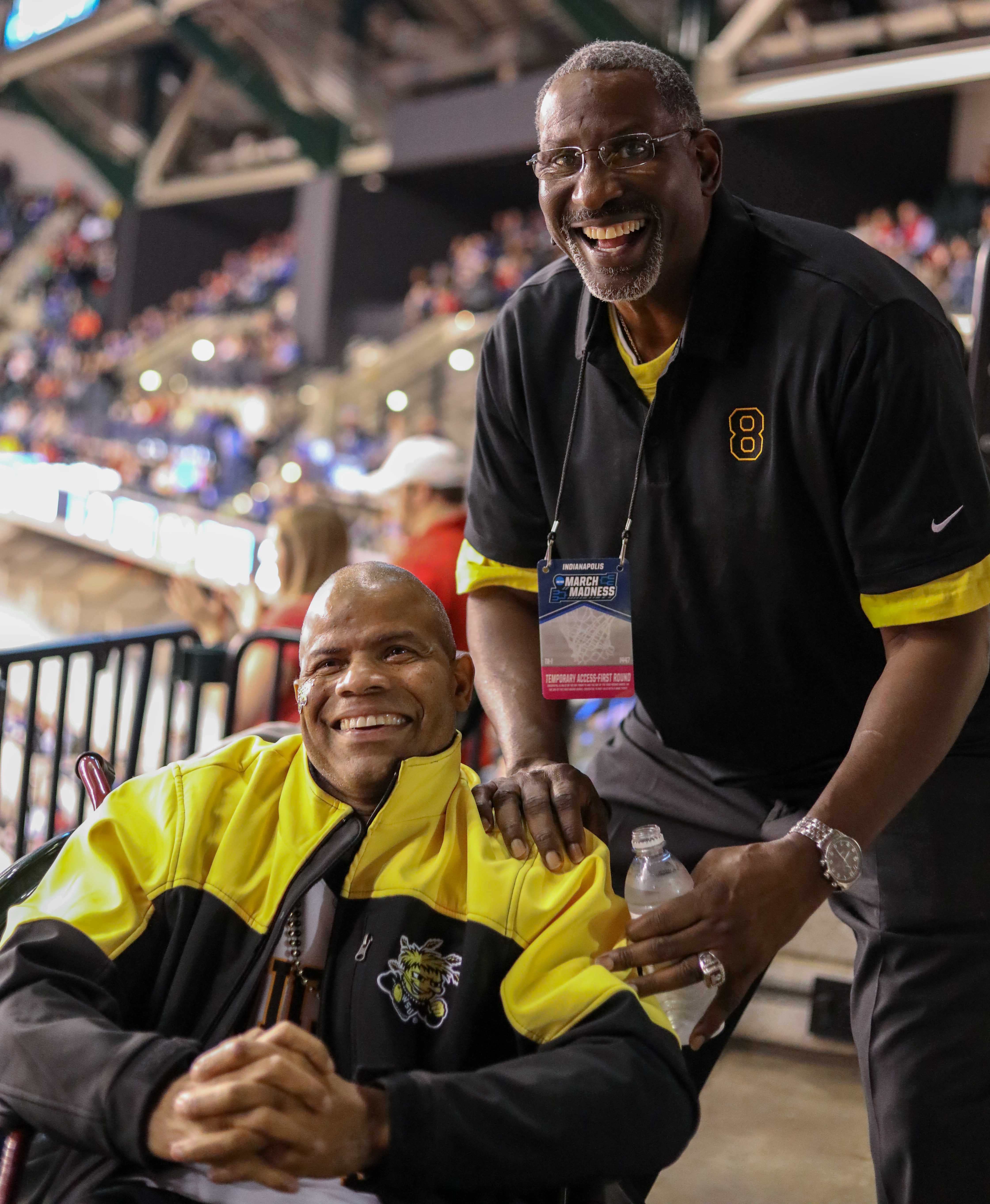 Cliff Levingston poses for a photo with long time fan Darren Thomas. Levingston played basketball for Wichita State from 1979-1982 before being drafted by the Detroit Pistons in 1982.