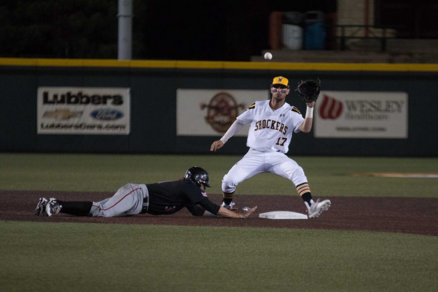 Junior Trey Vickers tags the base to get a Texas Tech player out.
