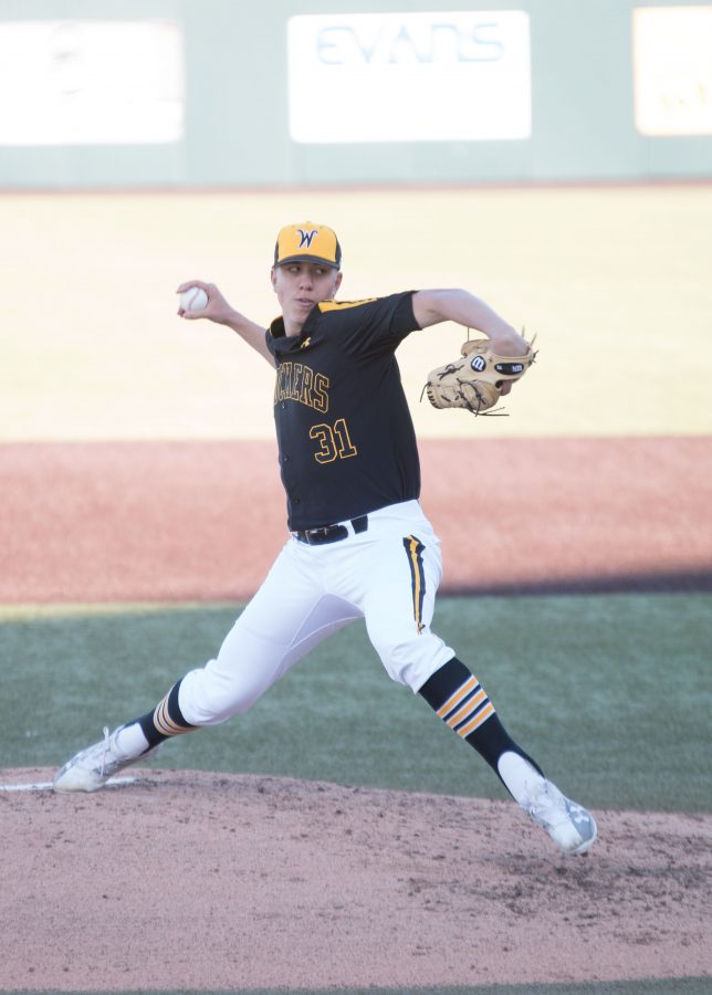 Sophomore Connor Lungwitz winds up a pitch against the Mavericks. Shockers won the game against Omaha with a score of 8-0, making this their seventh consecutive win this season. 