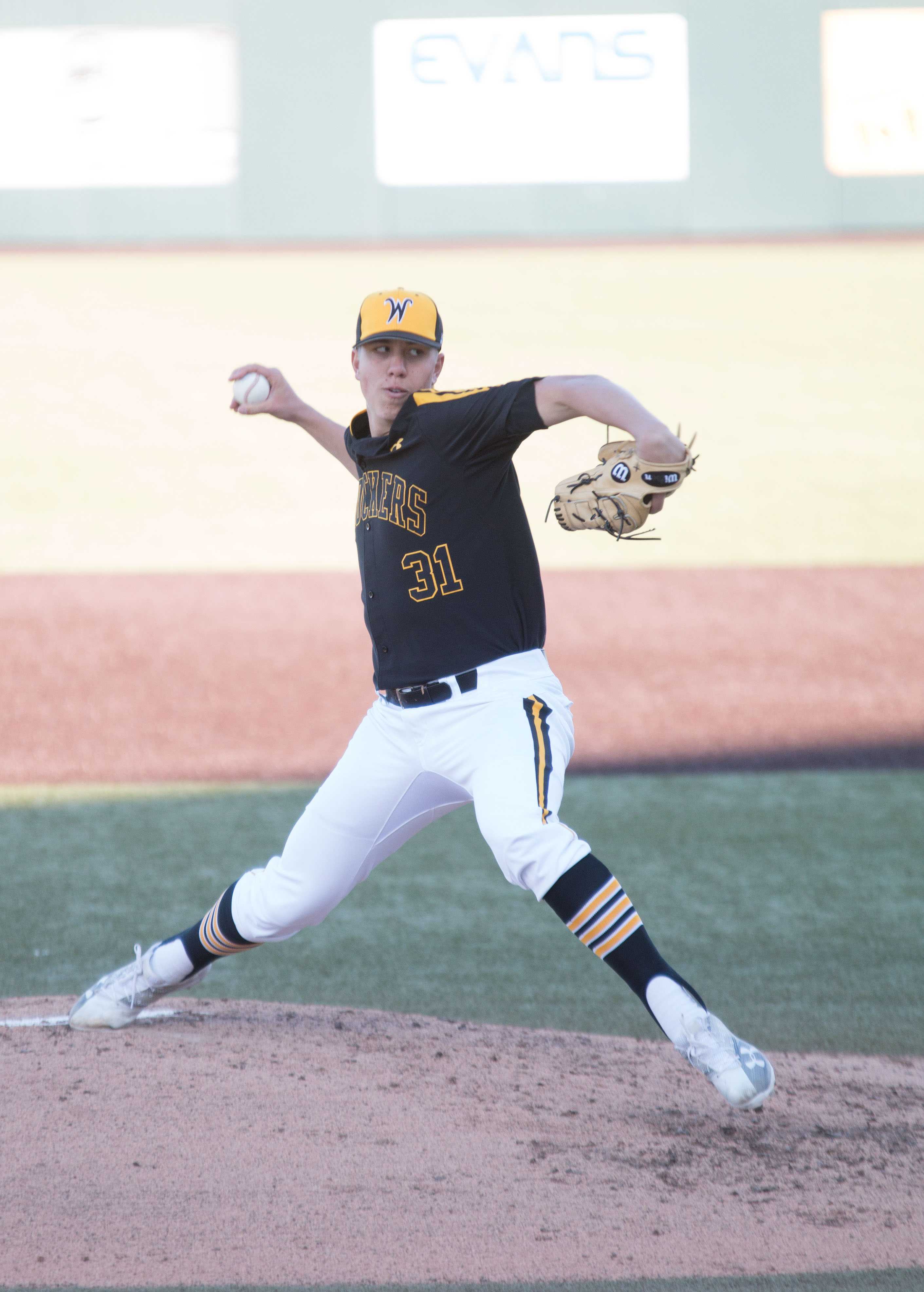 Sophomore Connor Lungwitz winds up a pitch against the Mavericks. Shockers won the game against Omaha with a score of 8-0, making this their seventh consecutive win this season.
