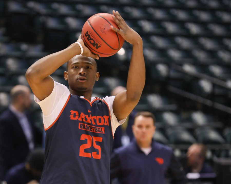 Dayton’s Kendall Pollard practices shooting threes at the open practice in Bankers Life Fieldhouse before facing Wichita State University Shockers on Friday. (Mar. 16, 2017)