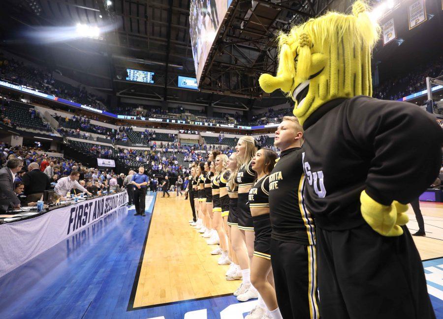 Wichita State cheer and dance team sing the alma mater in front of the fan section in Bankers Life Fieldhouse after the Shockers lost to Kentucky 65 – 62. 
(Mar. 19, 2017)