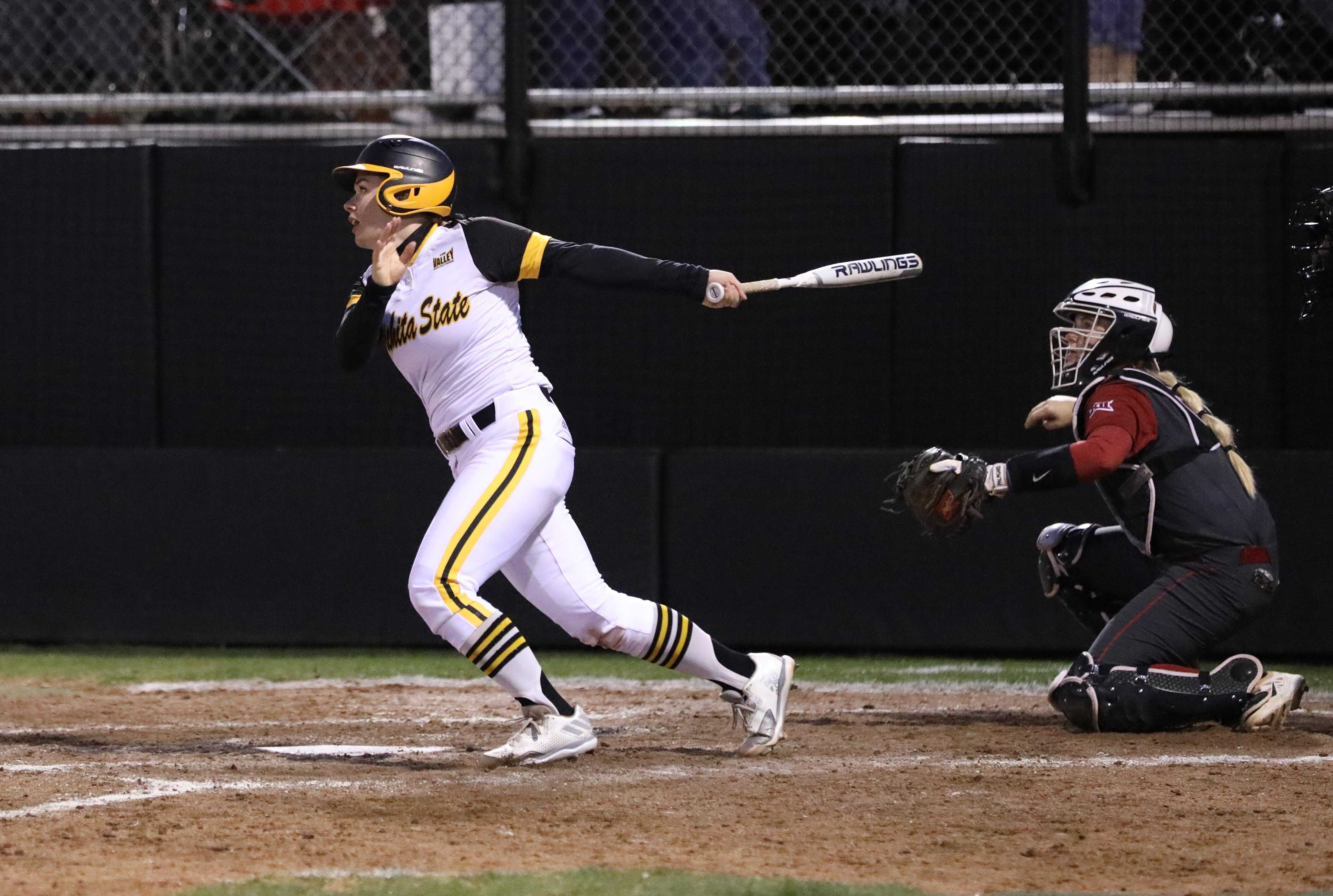 Wichita State junior Mackenzie Wright (10) watches after a hit Wednesday afternoon against Oklahoma. (Mar. 1, 2017)