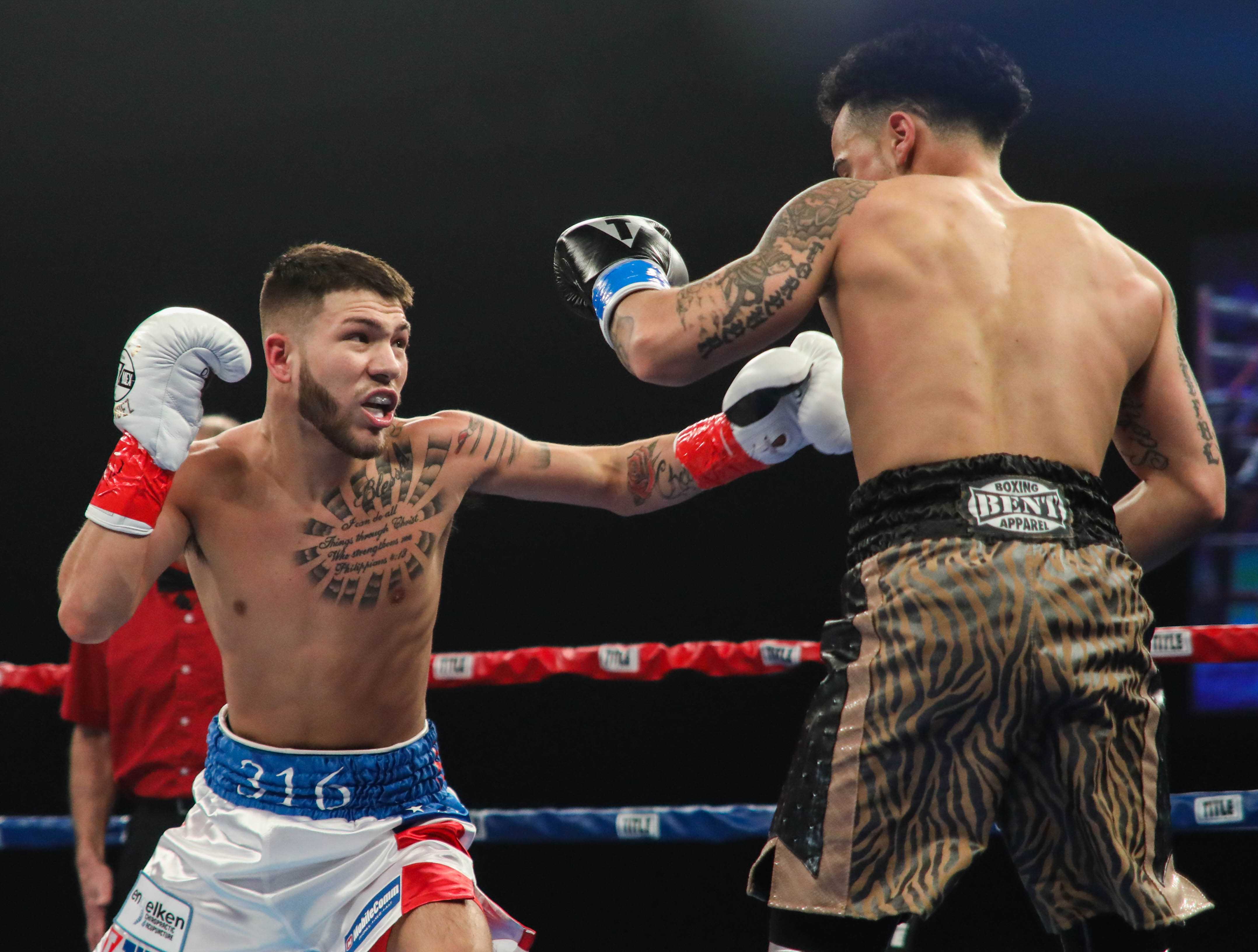 Nico Hernandez throws a left hook against Pat Gutierrez during the first round at Kansas Star Arena in Mulvane. (Mar. 25, 2017)