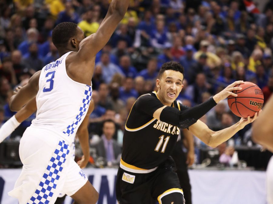 Wichita States Landry Shamet (11) fakes a pass before shooting over Kentucky forward Bam Adebayo (3). 