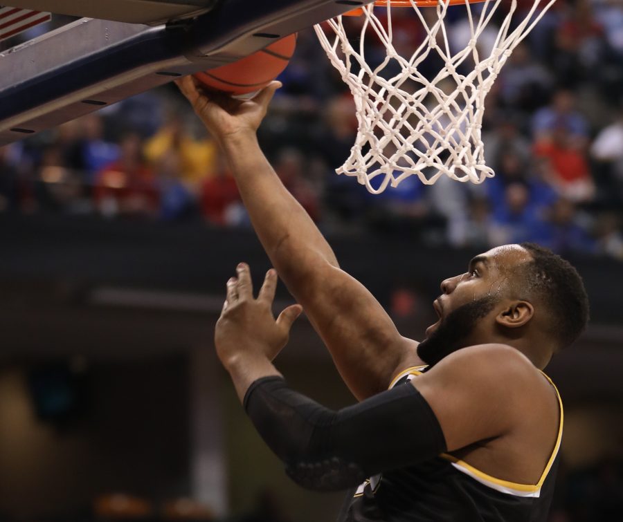 Wichita State’s Shaquille Morris hits a layup against Dayton in the second half at Bankers Life Fieldhouse in Indianapolis. The Shockers beat the Flyers 64 – 58 (Mar. 17, 17, 2017)