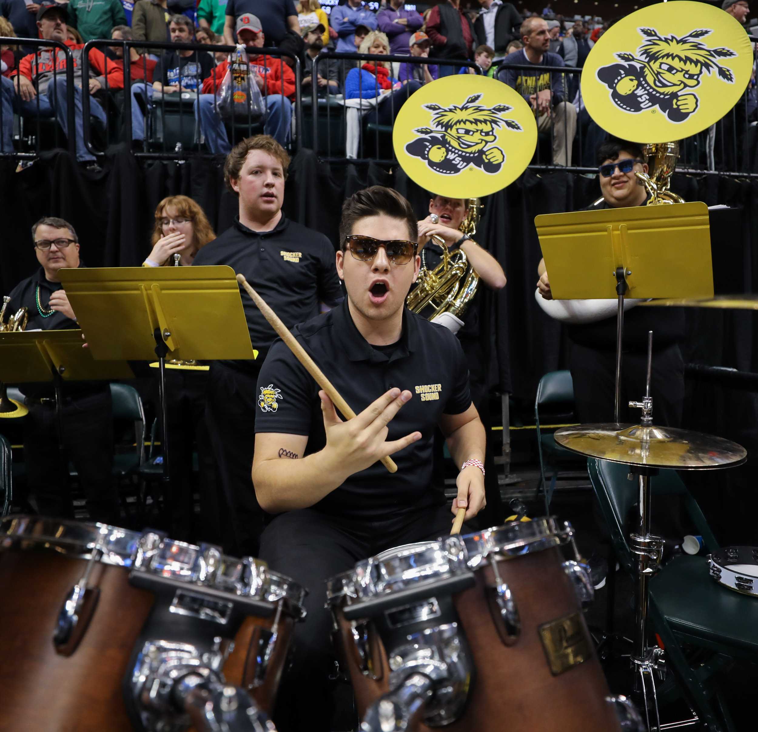 A member of the Wichita State band celebrates the Shockers’ 64 – 58 victory over the Dayton Flyer at Bankers Life Fieldhouse in Indianapolis. (Mar. 17, 2017)