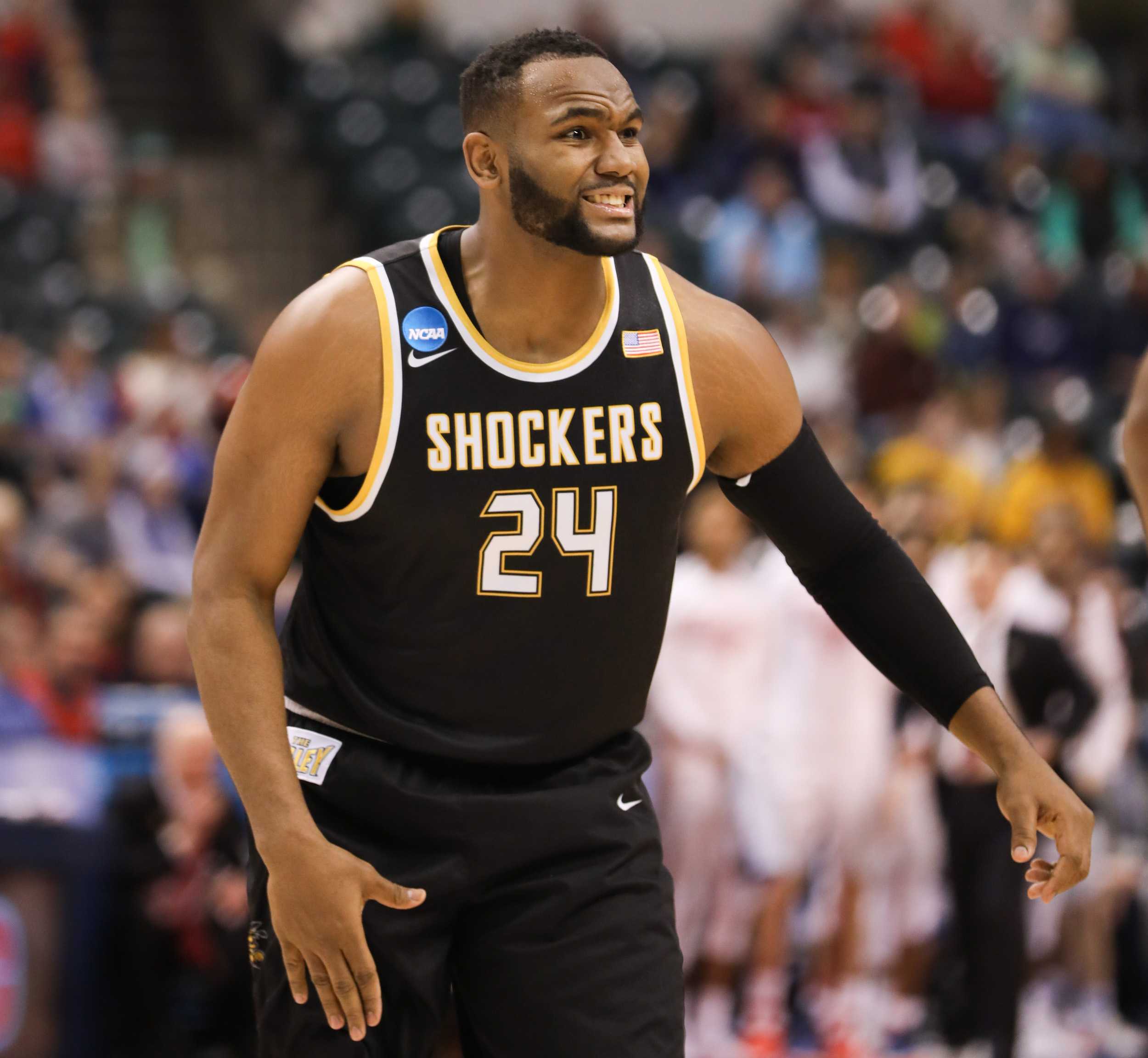 Wichita State’s Shaquille Morris tries to explain how he was fouled in the first half against Dayton at Bankers Life Fieldhouse in Indianapolis. (Mar. 17, 17, 2017)