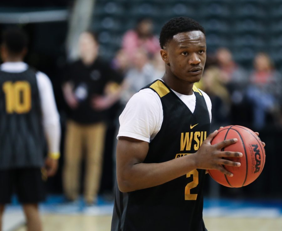 Wichita State’s Daishon Smith warms up during the open practice in Bankers Life Fieldhouse in Indianapolis. The Shockers play Dayton in the first round of the NCAA Tournament. (Mar. 16, 2017)