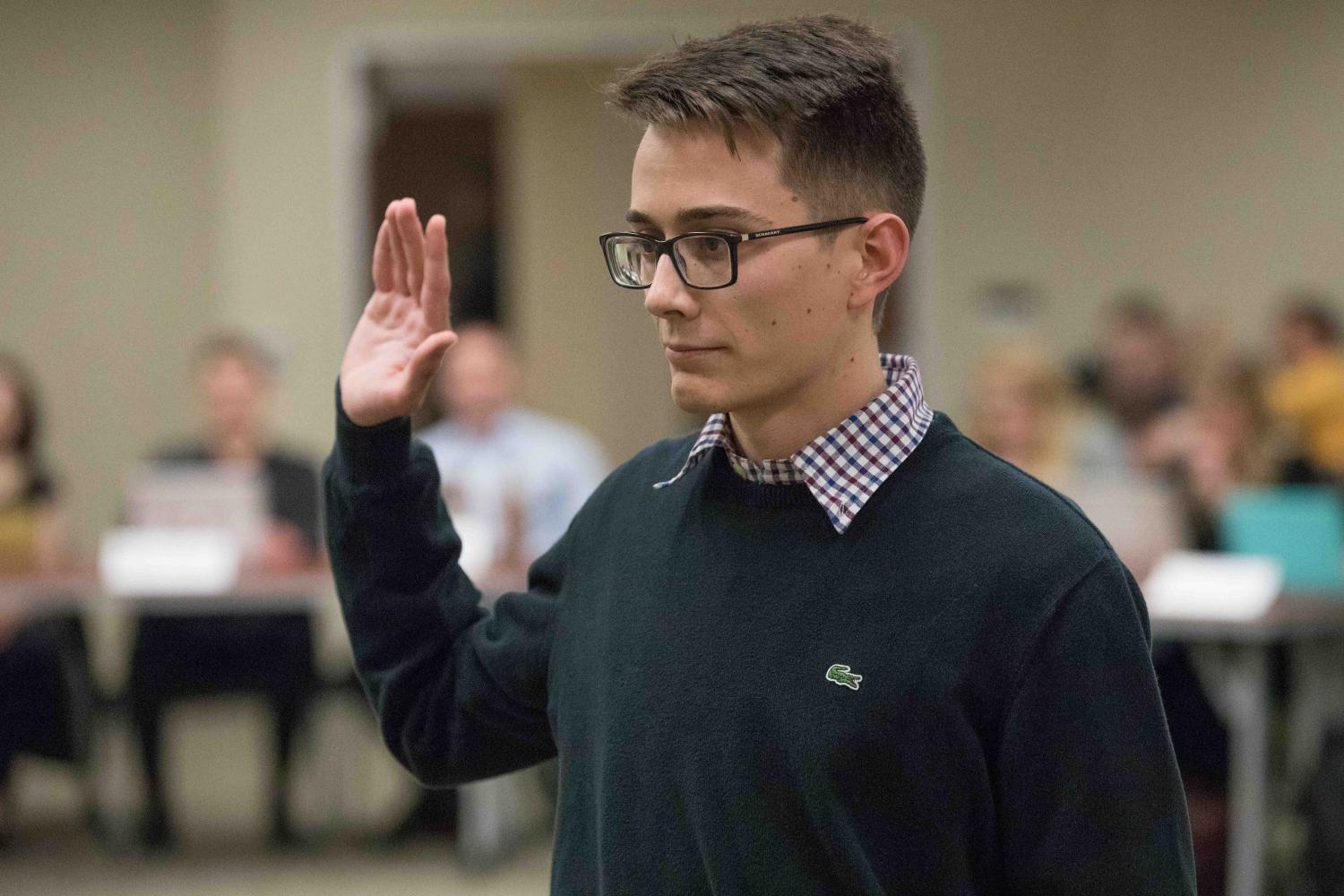 Andrew+Linnabary%2C+former+managing+editor+for+The+Sunflower%2C+is+sworn+in+as+SGAs+Director+of+Public+Relations.+Linnabary+will+serve+as+DPR+for+the+60th+Session+of+Wichita+States+Student+Government+Association.+