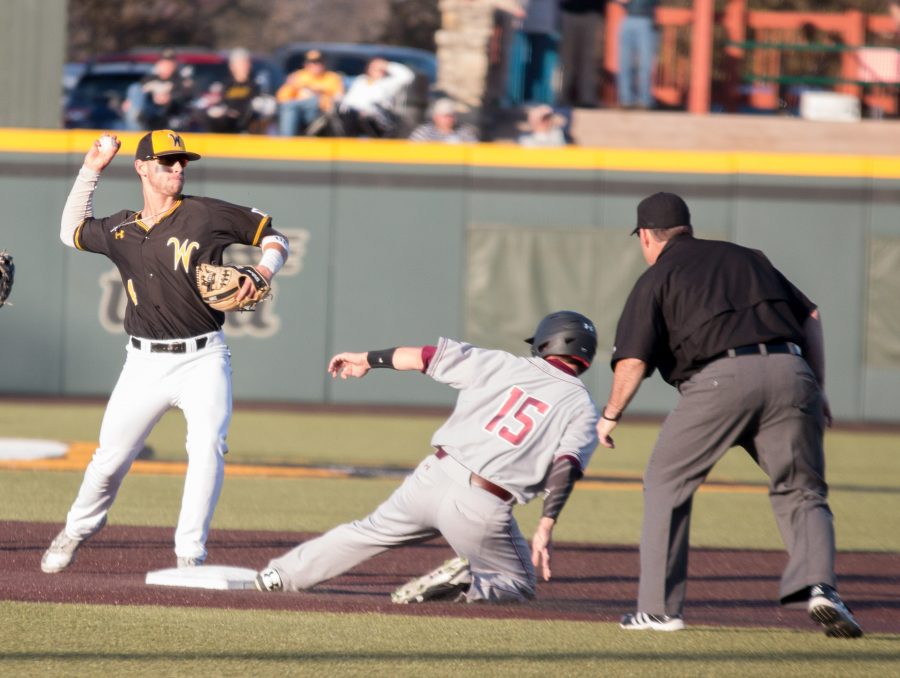 Redshirt Sophomore Jordan Boyer throws to first base after tagging a Southern Illinois player. 