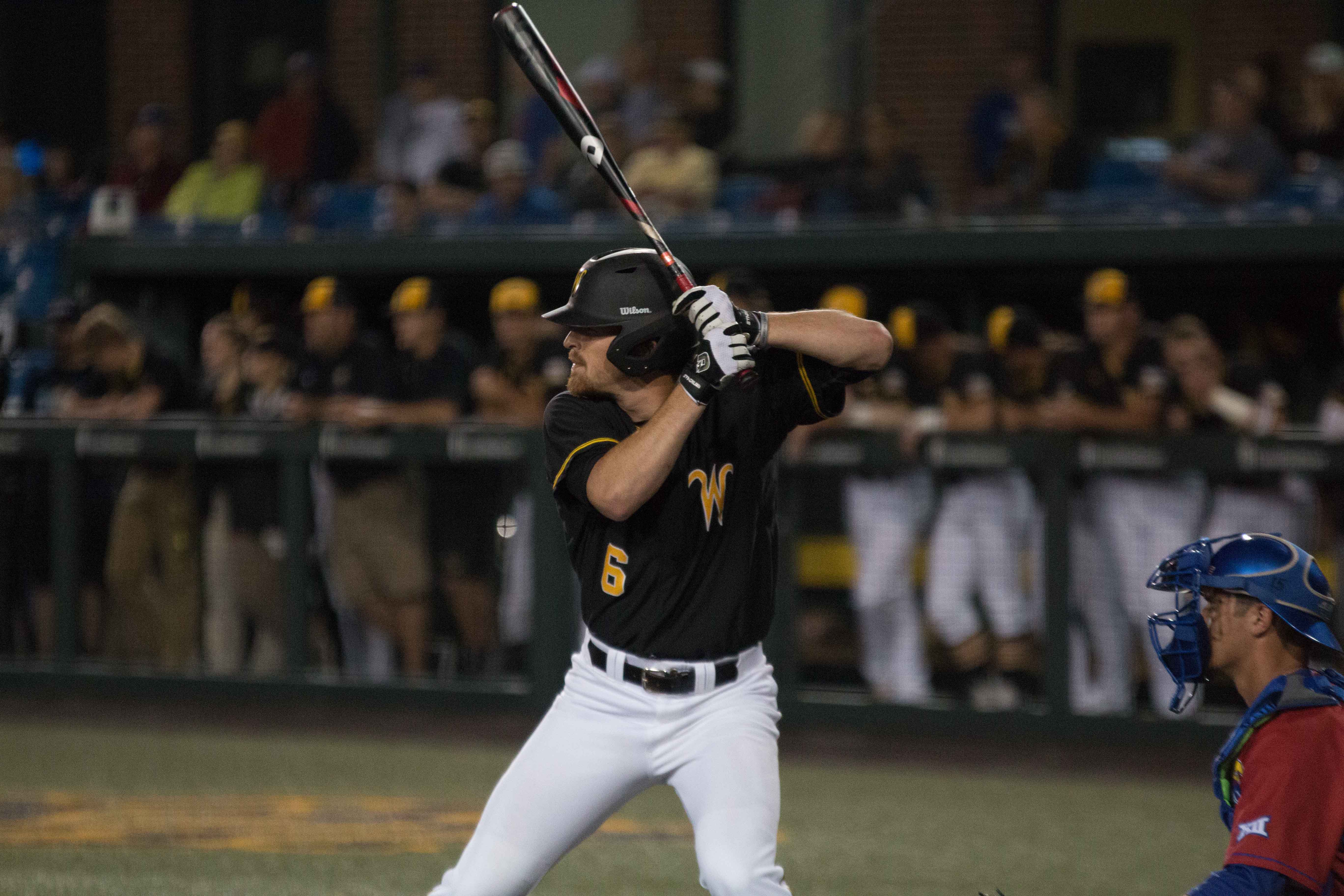 Senior Willie Schwanke watches a pitch at the plate on April 19 against
Kansas. Schwanke moved from pitcher to designated hitter this season. (File photo)