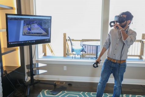 Wichita State graduate student Humam Nameer demonstrates his virtual reality program he created.