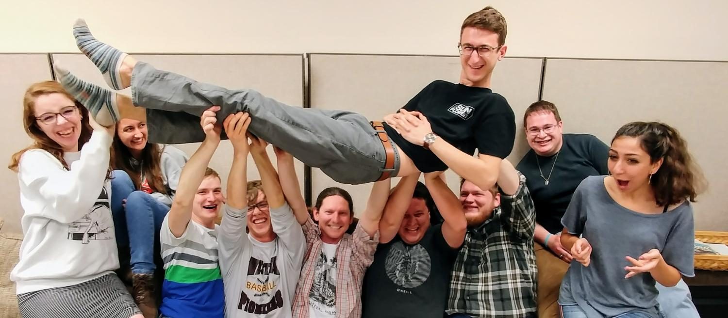 From left to right, Madeline Deabler, Selena Favela, Sam Belsan, Chance Swaim, Matt Crow, Brian Hayes, TJ Rigg and Jenna Farhat lift Evan Pflugradt on The Sunflowers final night of production. 