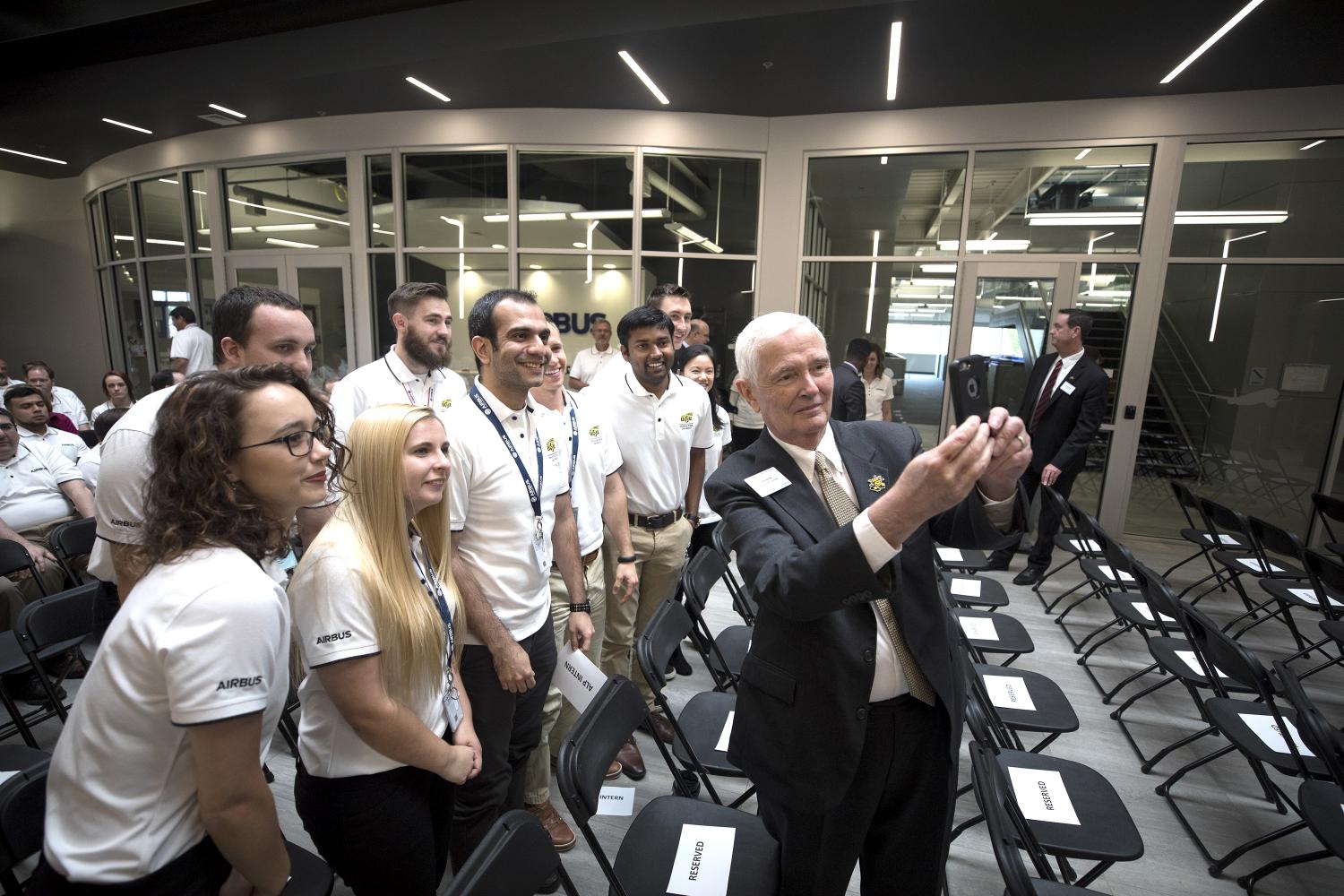 President John Bardo takes a selfie with students at the AirBus Americas grand opening last week.