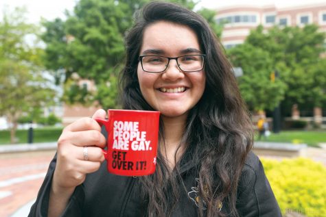 Christine Fuston poses with her favorite mug. Fuston recently spoke
at TEDxWichitaStateUniversity about coming out as a lesbian. 