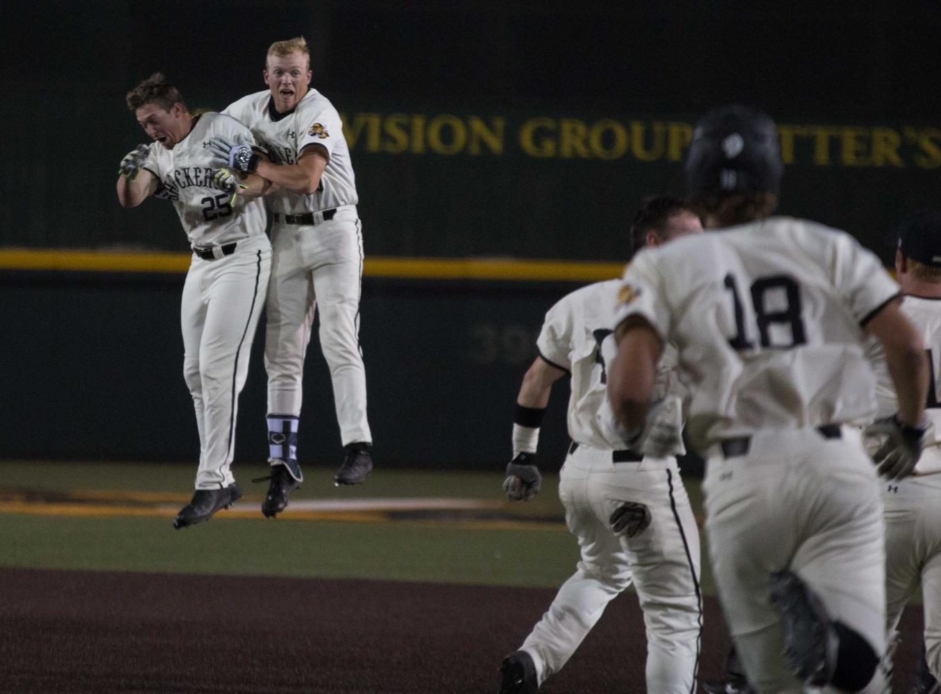 Wichita State sophomore Greyson Jenista celebrates with teammate Dayton Dugas after hitting a walk-off single against Oral Roberts. 