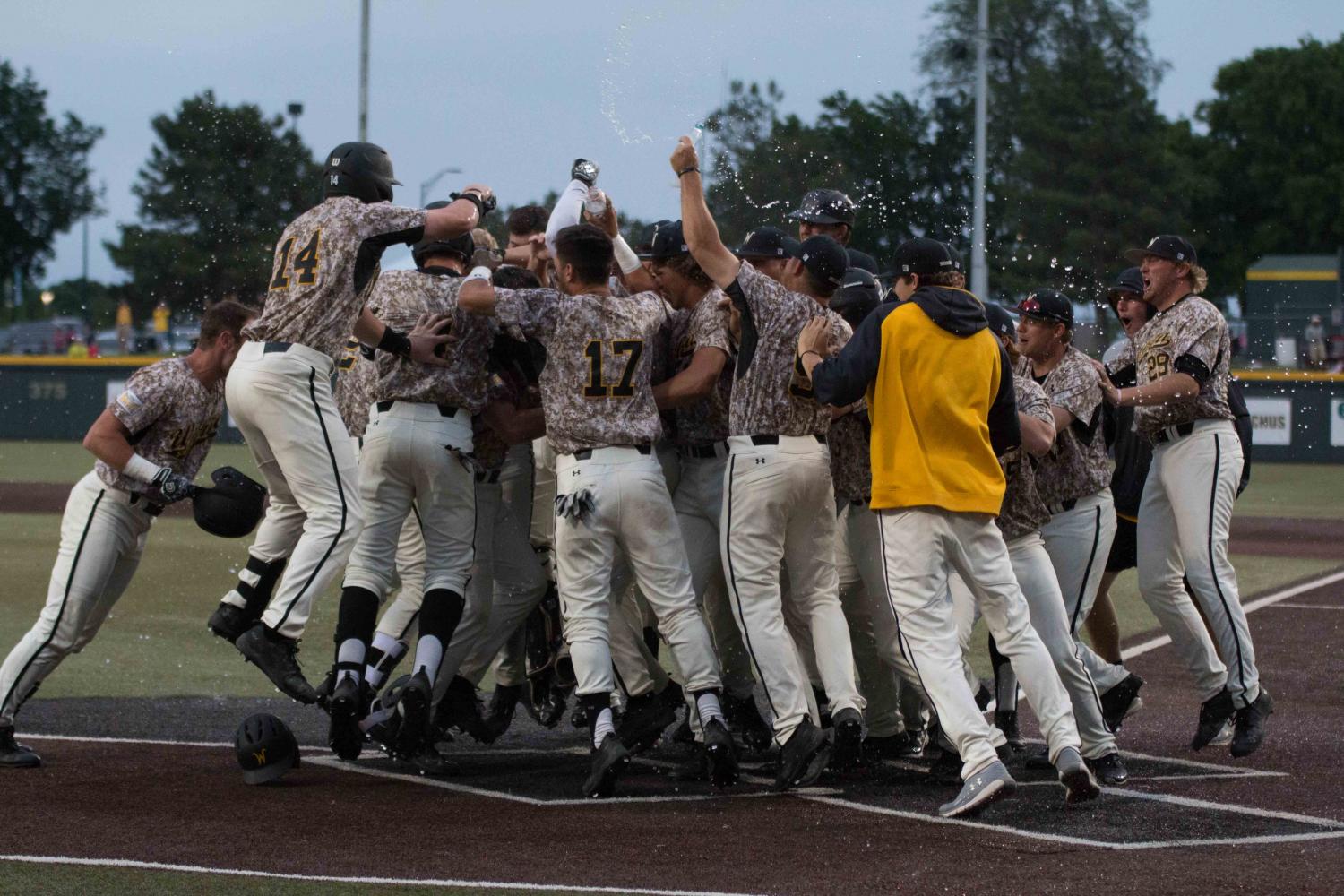 Shockers celebrate after winning their game against K-State Tuesday evening at Eck Stadium. 