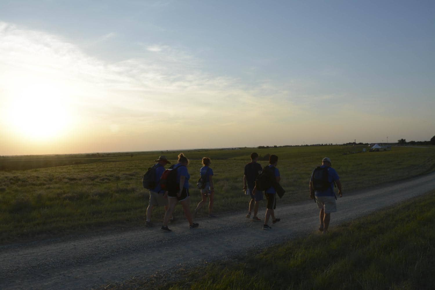 Wichita State students enrolled in the Flint Hills Media Project explore the site of the Symphony in the Flint Hills the week before the concert. The summer class, led by professors Amy DeVault and Kevin Hager, immerses students in the setting of the stories they cover. 