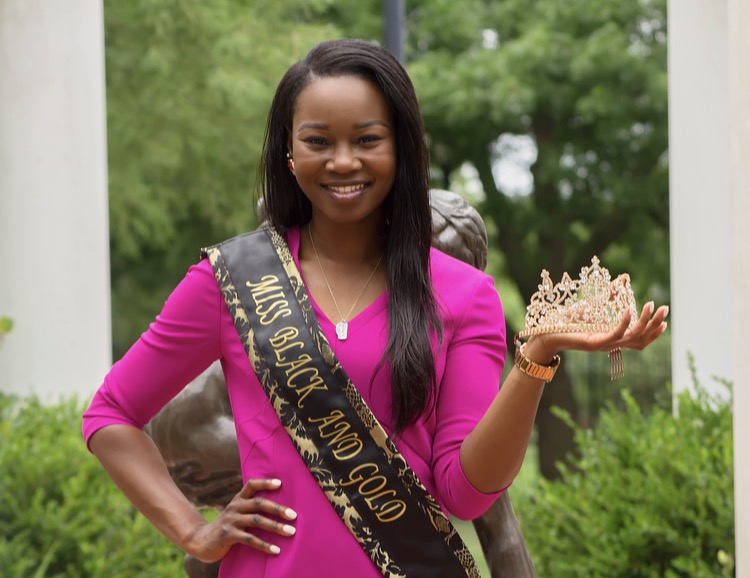 Miss Black and Gold Elizabeth Oshakuade holds her crown. 