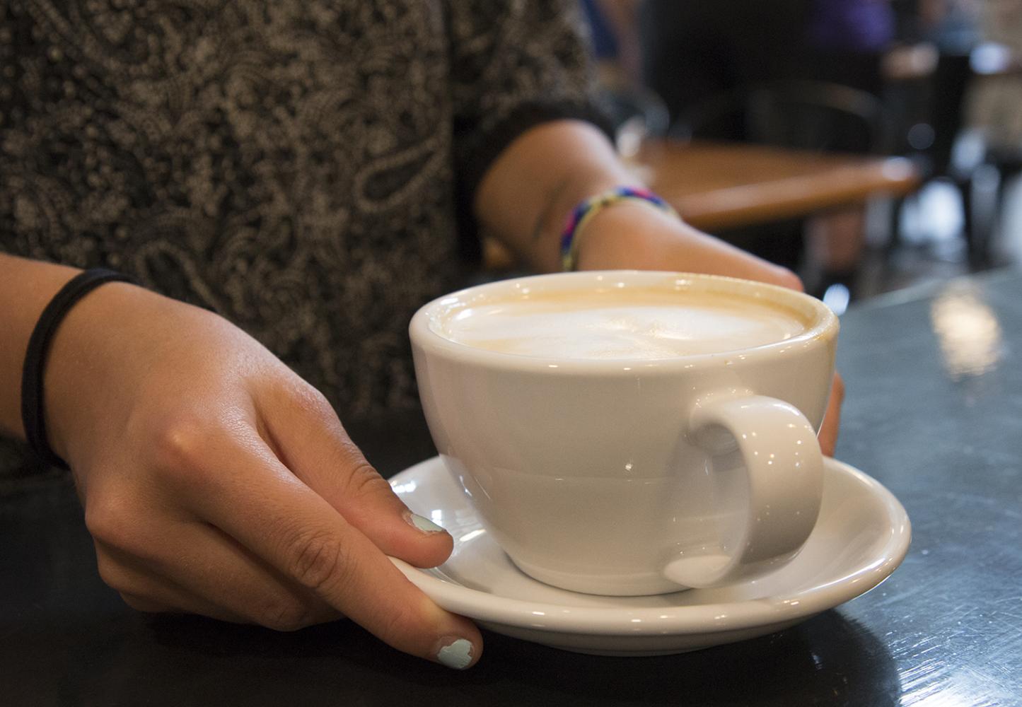 Customers wait patiently for their morning caffeine during the grand opening of Fairmount Coffee Co.