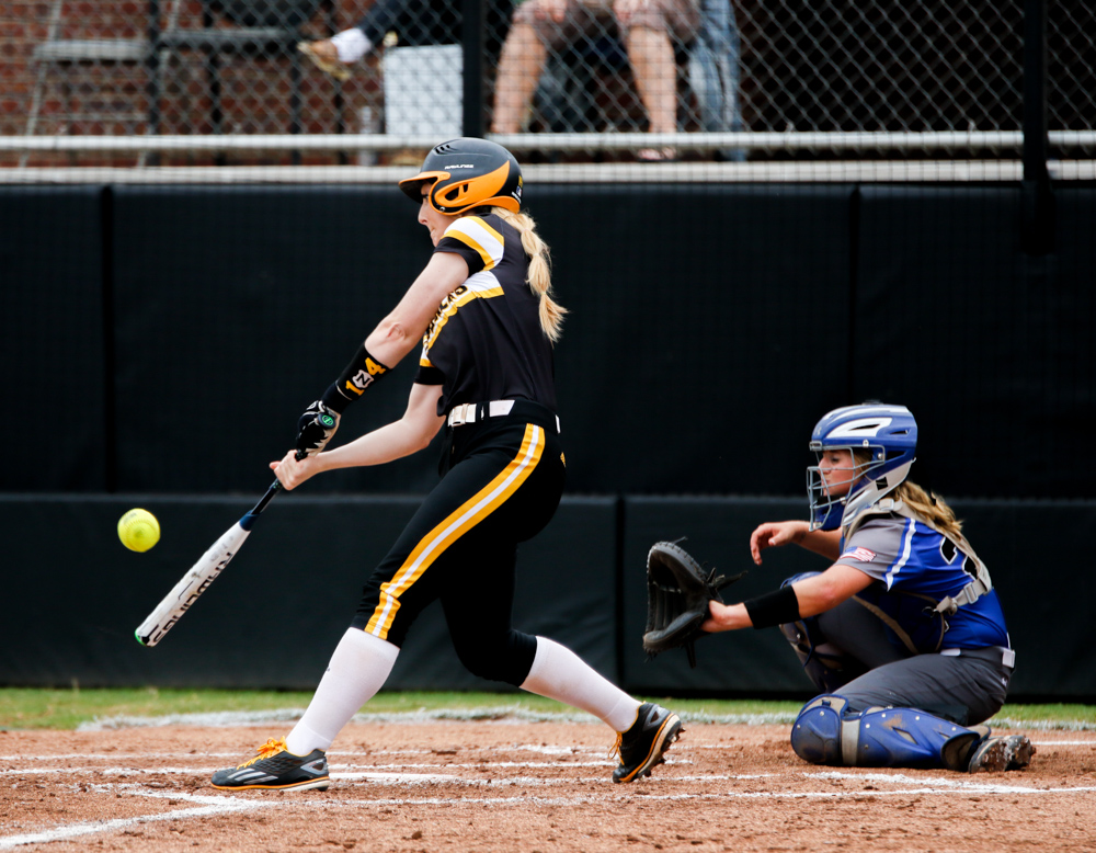 Wichita States Ashton Esparza (14) swings for a ball against Crowder at Wilkins Stadium on Sunday afternoon. (Sept. 17, 2017)