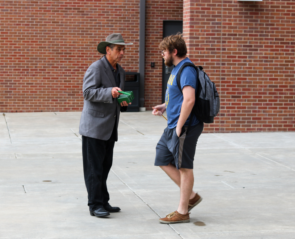 FILE PHOTO: Ed Bogner speaks to students by Shocker Hall and gives out free copies of the New Testament.