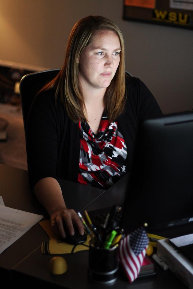 Sarah Sell, director of veteran student services, works in her office. 