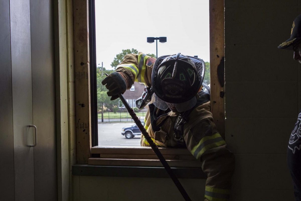 Testing the second floor for stability before entering. (Instructor Chief David Rhodes from Atlanta Fire Rescue)
