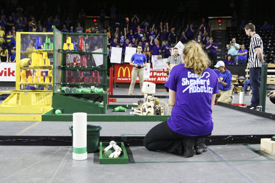 High school students compete in a robotics competition at Koch Arena.