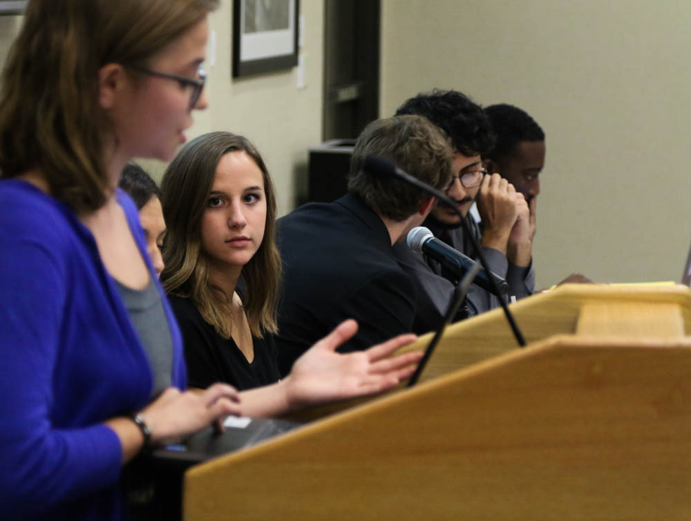SGA president Paige Hungate listens to senator Xan Mattek propose a bill she co-authored. 