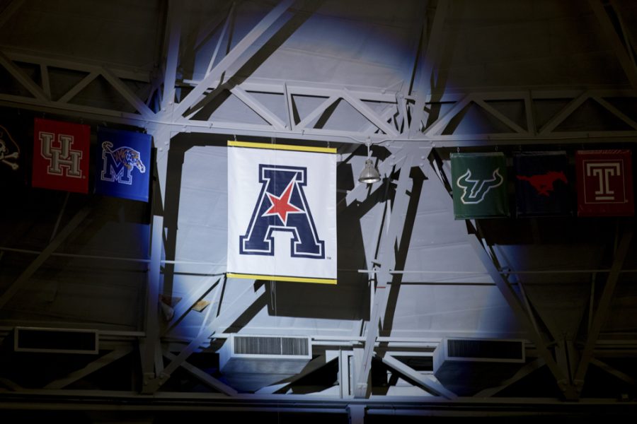 The AAC banner is unveiled during the State of the American event in Koch arena.