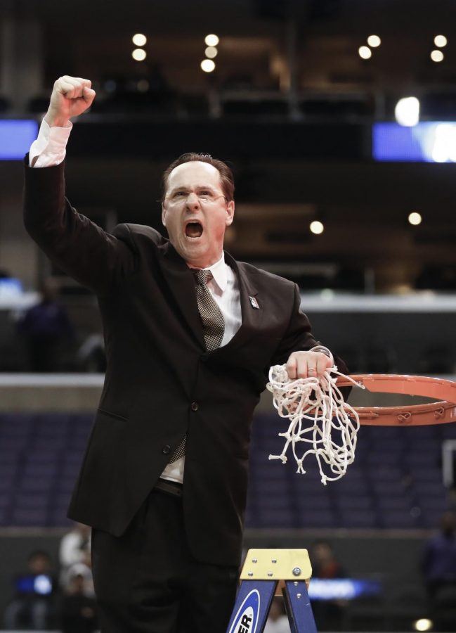 Wichita State head coach Gregg Marshall cuts the net. 