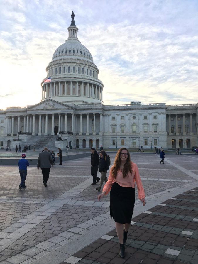 Kylie Cameron stands in front of the Capitol building.